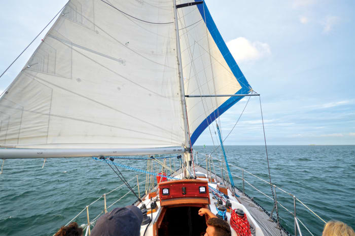 pole on a sailboat that holds sails