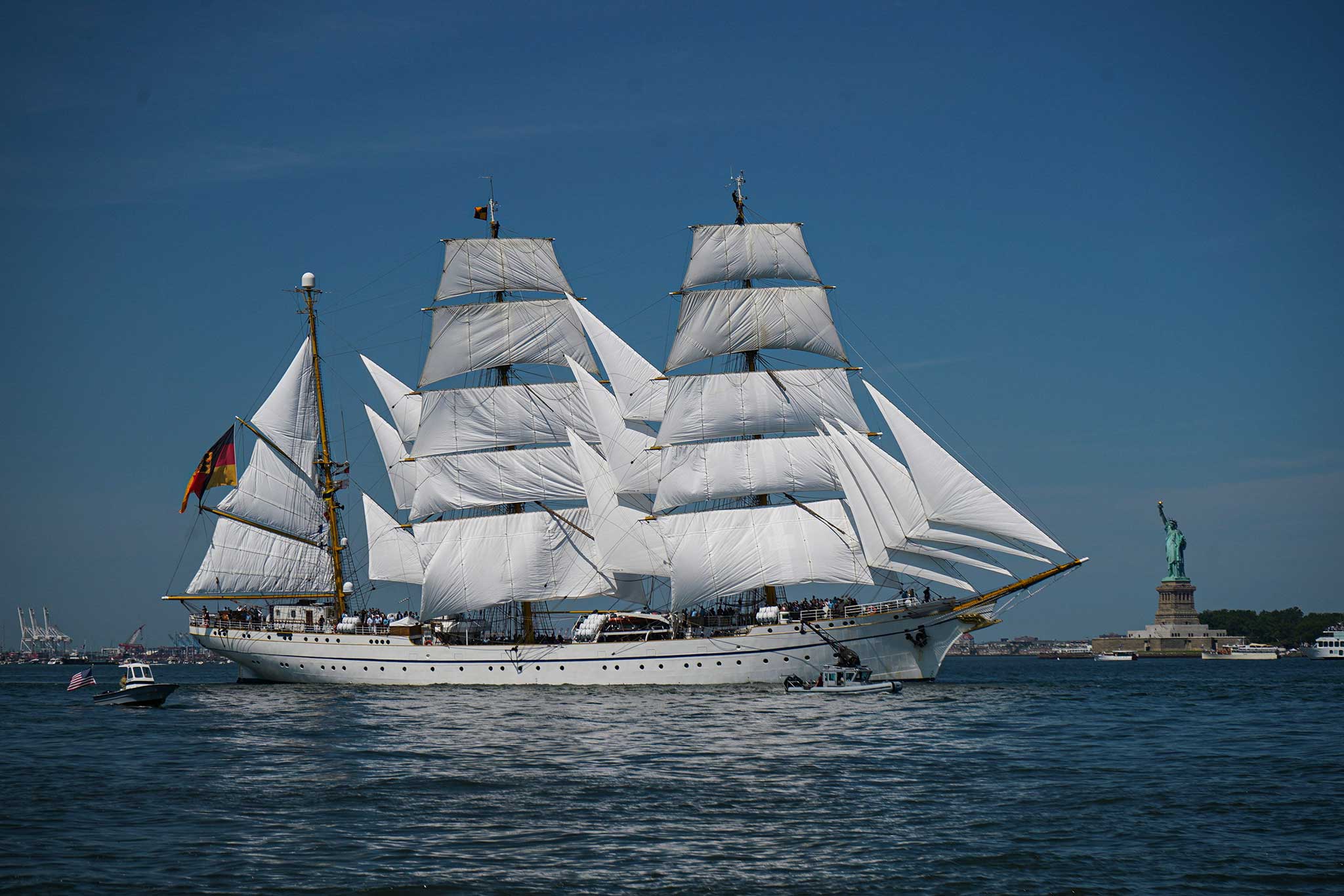 Tallship in New York with the statue of liberty