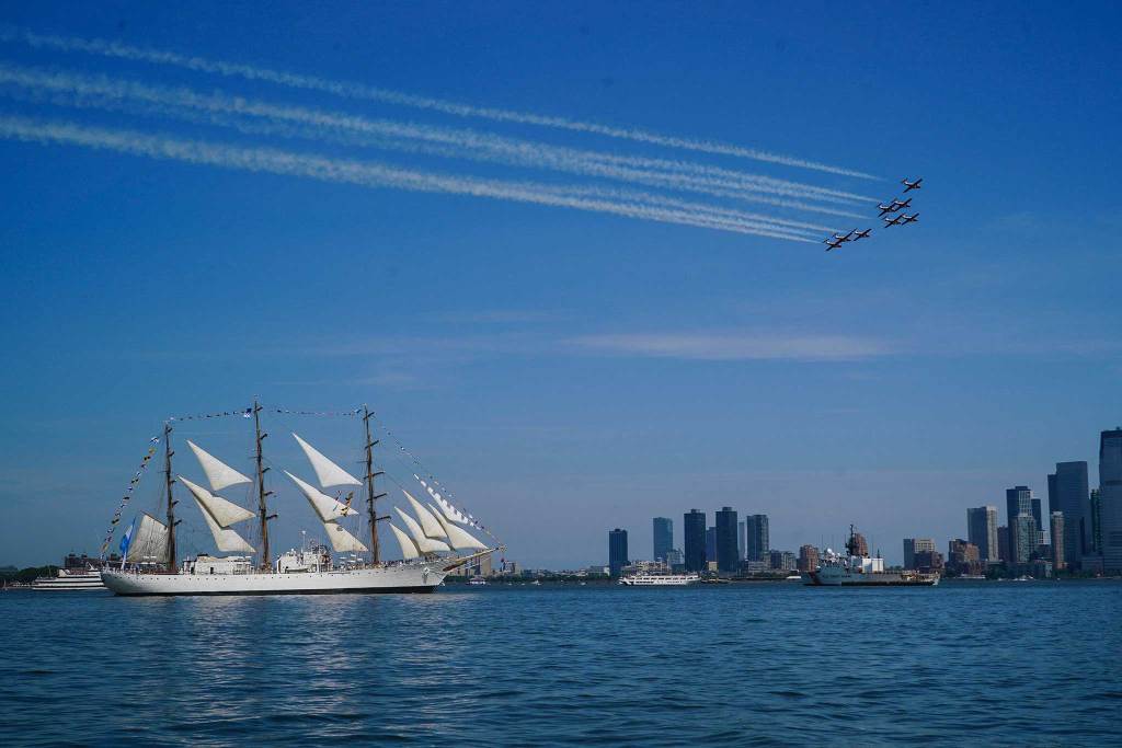 Tallship in NYC harbor with jets flying above