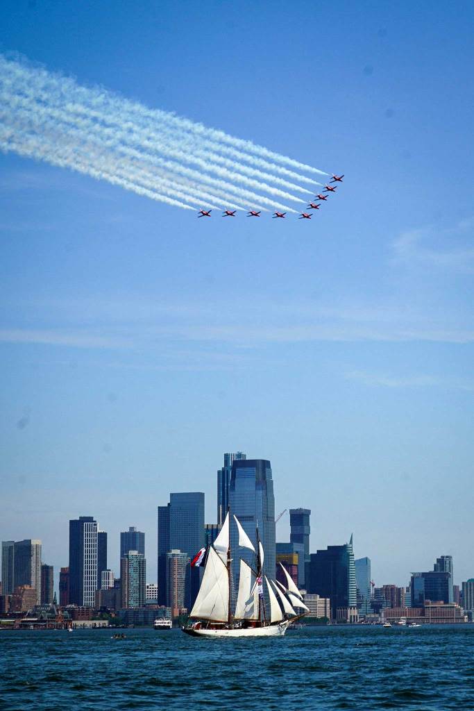 Tallship in NYC harbor with jets flying overhead
