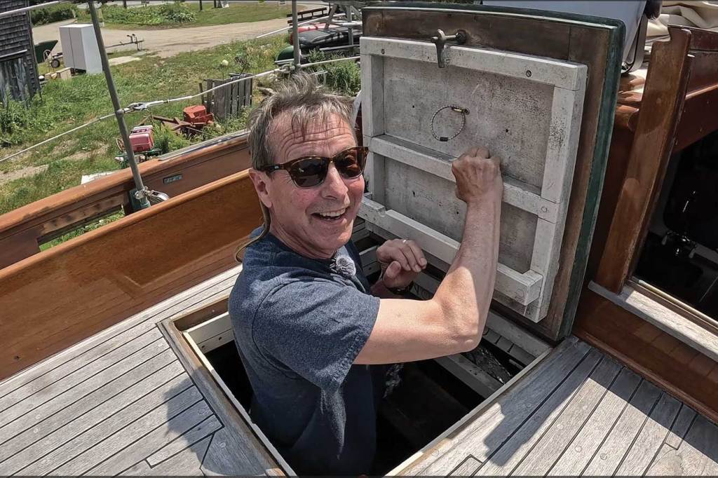 Man coming in or going out of a hatch